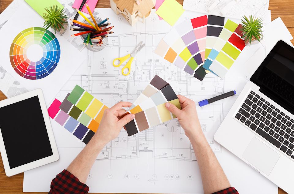 interior designer using colour wheel to pick colour scheme
