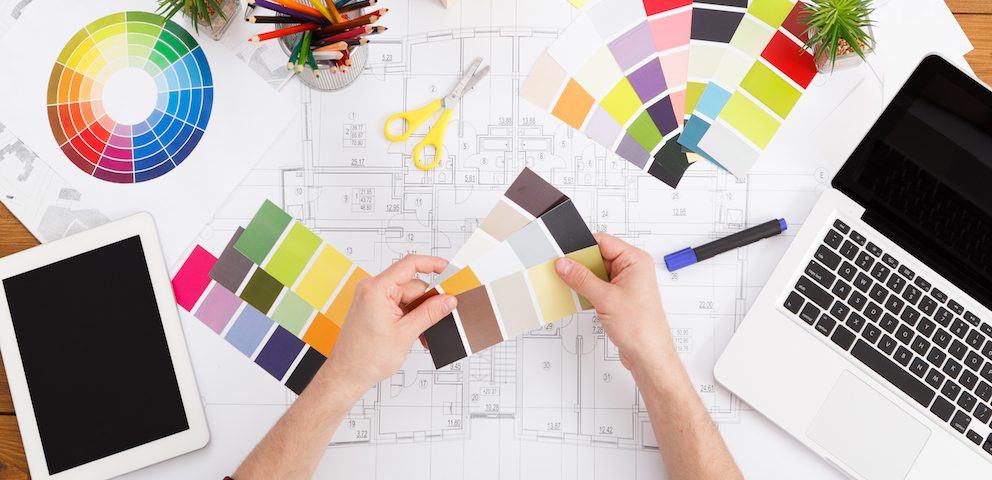interior designer using colour wheel to pick colour scheme