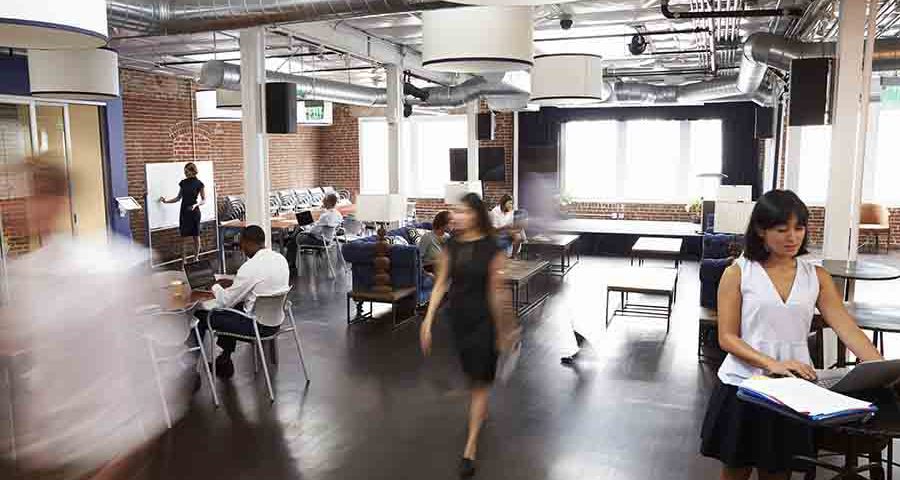 open office interior design theme with employees moving about
